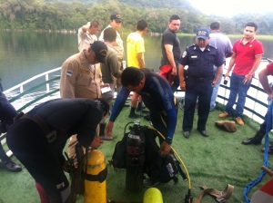 Divers getting ready to go down deep in this lake to search for Peter's body.