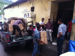 Unloading the blankets and backpacks we brought for the inmates