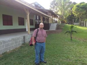 Allen Summy in front of School Building